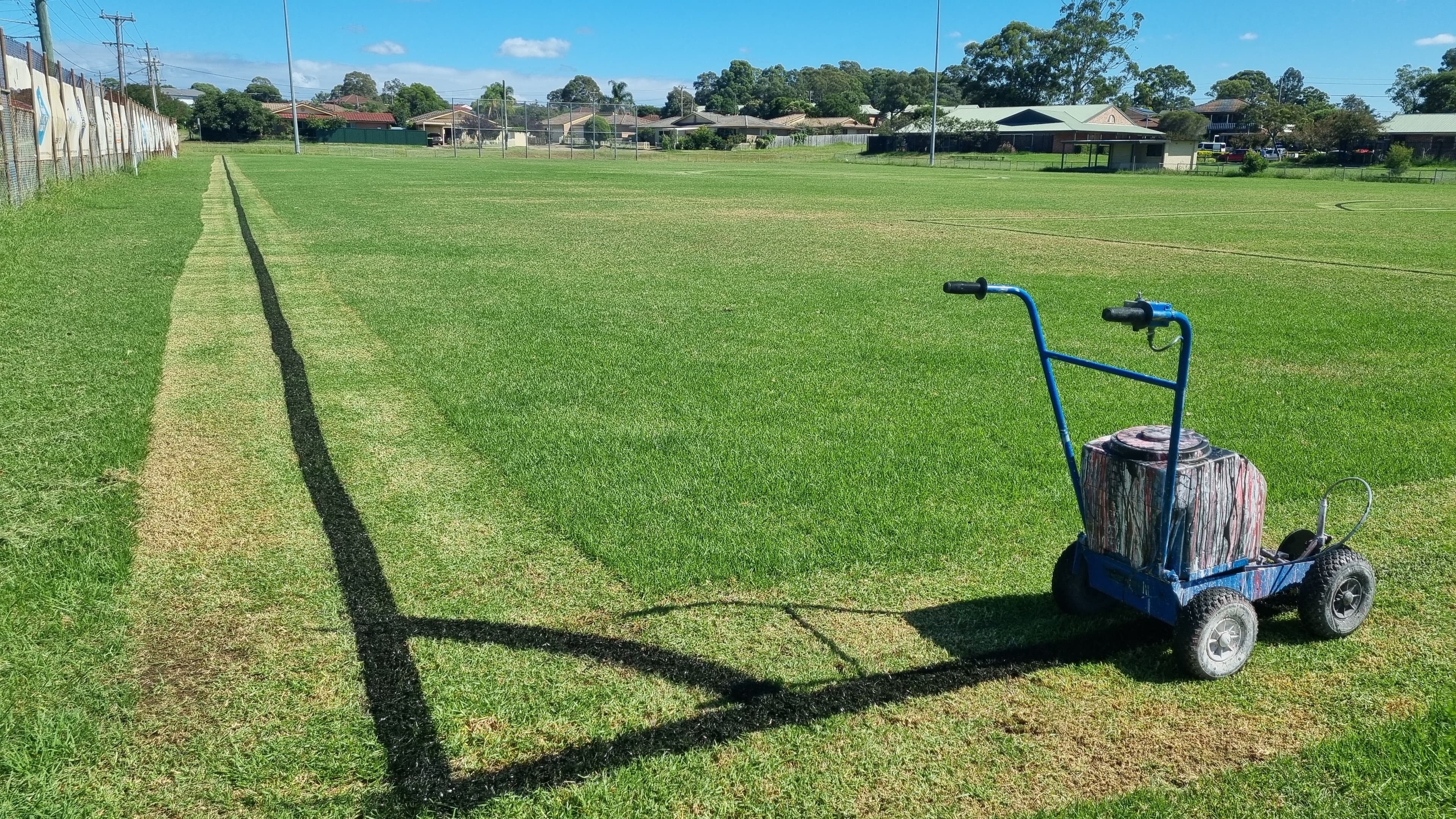 Line marking machine painting crisp corners on a sports field